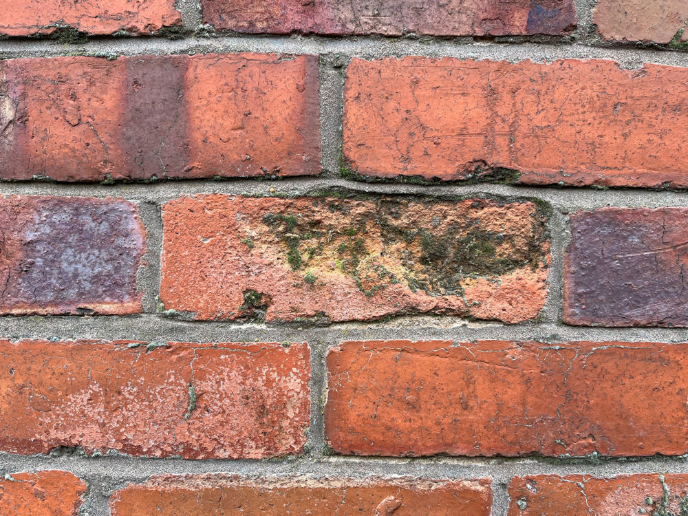 Spalling bricks causing discolouration